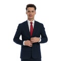 businessman closing his jacket and smiling Royalty Free Stock Photo