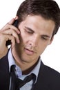 Young businessman conversing on cell phone Royalty Free Stock Photo