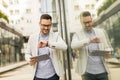 Young businessman with digital tablet by the office building Royalty Free Stock Photo