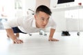 Young businessman doing exercises in office Royalty Free Stock Photo