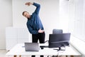 Young Businessman Doing Stretching Exercise Royalty Free Stock Photo