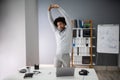 Young Businessman Doing Stretching Exercise Royalty Free Stock Photo