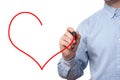 Young businessman drawing red heart. Isolated on white Royalty Free Stock Photo