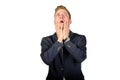 Young businessman dressed in a suit desperate look up on white.