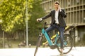 Young businessman on the ebike using mobile phone Royalty Free Stock Photo