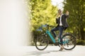 Young businessman on the ebike using mobile phone Royalty Free Stock Photo