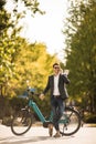 Young businessman on the ebike using mobile phone Royalty Free Stock Photo