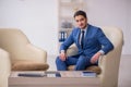 Young male employee waiting for business meeting Royalty Free Stock Photo