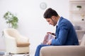 Young businessman employee waiting for business meeting Royalty Free Stock Photo