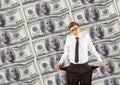 Young businessman with empty pockets. money background Royalty Free Stock Photo