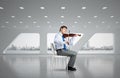 young businessman playing violin Royalty Free Stock Photo