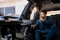 Young businessman enjoying champagne in limo