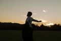 Young businessman enjoying his freedom standing in meadow Royalty Free Stock Photo