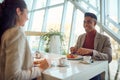 A young businessman is enjoying a lunch break in the canteen with his young female colleague. Business, people, company Royalty Free Stock Photo