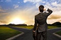 Young businessman in front of a crossroad Royalty Free Stock Photo