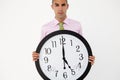 Young businessman with giant clock Royalty Free Stock Photo