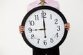 Young businessman with giant clock Royalty Free Stock Photo