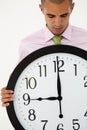 Young businessman with giant clock Royalty Free Stock Photo
