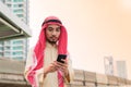 Young businessman handsom arabian handholding smart phone Royalty Free Stock Photo