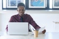 Young businessman handsome African American black skin working on laptop at office. businessperson in workplace Royalty Free Stock Photo