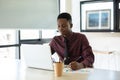 Young businessman handsome African American black skin working on laptop at office. businessperson in workplace Royalty Free Stock Photo