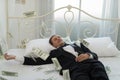 Young Businessman with happy, smile on the bed. who are successful in business and many banknote dollars money. business success Royalty Free Stock Photo