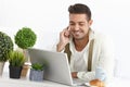 Young businessman having breakfast at home