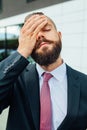 Young businessman having headache because of problems at work. Royalty Free Stock Photo