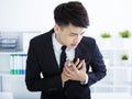 Young businessman having heart attack and chest pain Royalty Free Stock Photo