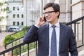 Young businessman having phone conversation Royalty Free Stock Photo