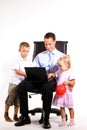 Young businessman with his son and daughter