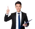 Young Businessman hold with clipboard and finger point up Royalty Free Stock Photo