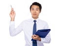 Young businessman hold with clipboard and pen point up Royalty Free Stock Photo