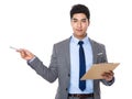 Young Businessman hold with clipboard and pen point up Royalty Free Stock Photo