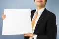 Young businessman holding blank sign Royalty Free Stock Photo