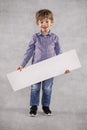 Young businessman holding a board with copy space, happiness