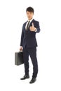 Young businessman holding a briefcase and thumb up Royalty Free Stock Photo