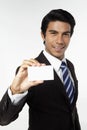 Young businessman holding business card. Conceptual image Royalty Free Stock Photo