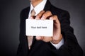 Young businessman holding card in hand Royalty Free Stock Photo