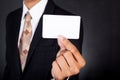 Young businessman holding card in hand Royalty Free Stock Photo