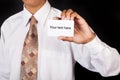 Young businessman holding card in hand Royalty Free Stock Photo