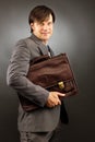 Young businessman holding his briefcase Royalty Free Stock Photo