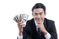 Young businessman Holding Money on white background Royalty Free Stock Photo