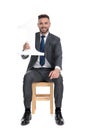 Young businessman holding number one sign and smiling Royalty Free Stock Photo