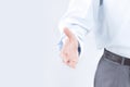 Young businessman holding out his hand for a handshake. Royalty Free Stock Photo