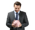 Young businessman holding piggy bank on white background. Savings money concept Royalty Free Stock Photo