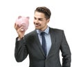 Young businessman holding piggy bank on white background. Savings money concept Royalty Free Stock Photo