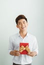 Young businessman holding with red gift box Royalty Free Stock Photo
