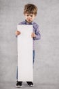 Young businessman holds an advertising space for sale, grimace o Royalty Free Stock Photo