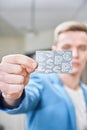 Young businessman holds a credit card in his hands. concept of success, startup Royalty Free Stock Photo